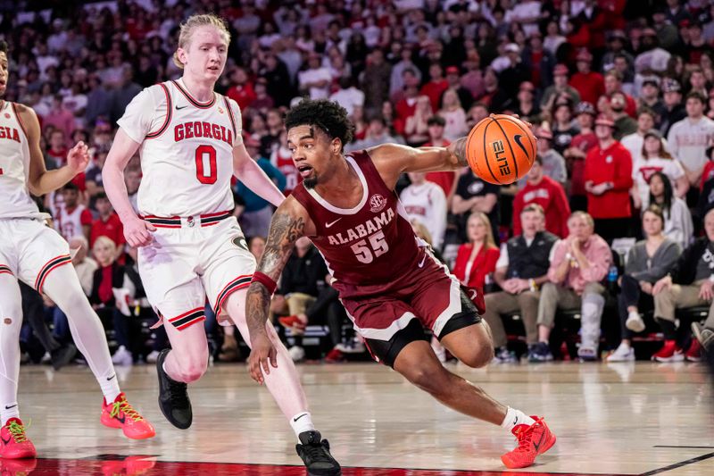 Jan 31, 2024; Athens, Georgia, USA; Alabama Crimson Tide guard Aaron Estrada (55) dribbles past Georgia Bulldogs guard Blue Cain (0) during the second half at Stegeman Coliseum. Mandatory Credit: Dale Zanine-USA TODAY Sports