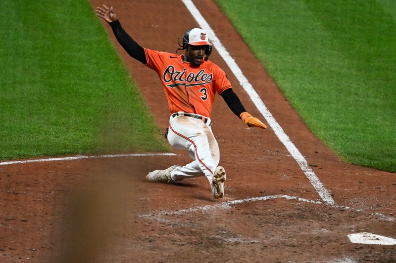 Sep 30, 2023; Baltimore, Maryland, USA;  Baltimore Orioles shortstop Jorge Mateo (3) slides and score during the eighth inning against the Boston Red Sox at Oriole Park at Camden Yards. Mandatory Credit: Tommy Gilligan-USA TODAY Sports