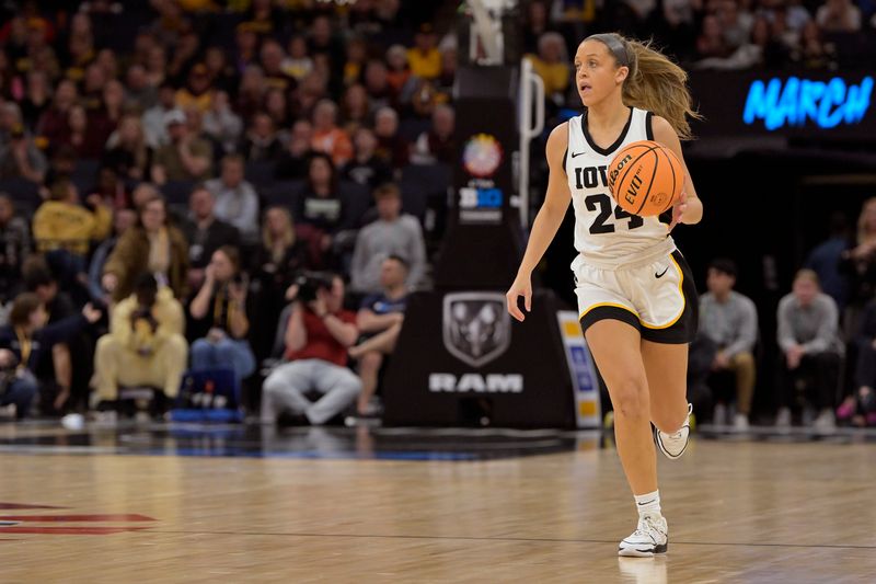 Mar 9, 2024; Minneapolis, MN, USA;  Iowa Hawkeyes guard Gabbie Marshall (24) brings the ball up-court against the Michigan Wolverines during the second half of a Big Ten Women's Basketball tournament semifinal at Target Center. Mandatory Credit: Nick Wosika-USA TODAY Sports