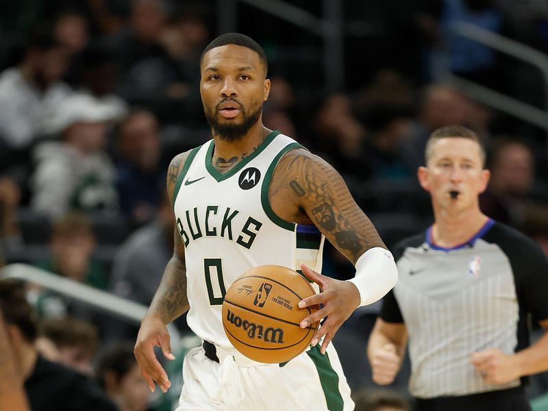 MILWAUKEE, WISCONSIN - OCTOBER 20: Damian Lillard #0 of the Milwaukee Bucks dribbles up court during the second half of the preseason game against the Memphis Grizzlies at Fiserv Forum on October 20, 2023 in Milwaukee, Wisconsin. NOTE TO USER: User expressly acknowledges and agrees that, by downloading and or using this photograph, User is consenting to the terms and conditions of the Getty Images License Agreement. (Photo by John Fisher/Getty Images)