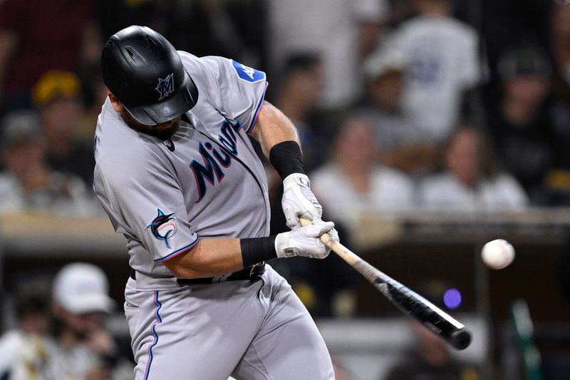 Aug 21, 2023; San Diego, California, USA; Miami Marlins third baseman Jake Burger (36) hits a single against the San Diego Padres during the fourth inning at Petco Park. Mandatory Credit: Orlando Ramirez-USA TODAY Sports