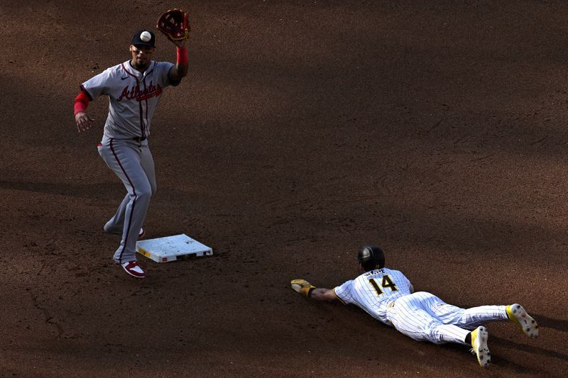 Jul 13, 2024; San Diego, California, USA; San Diego Padres shortstop Tyler Wade (14) steals second base ahed of the throw to Atlanta Braves shortstop Orlando Arcia (11) during the fifth inning at Petco Park. Mandatory Credit: Orlando Ramirez-USA TODAY Sports 