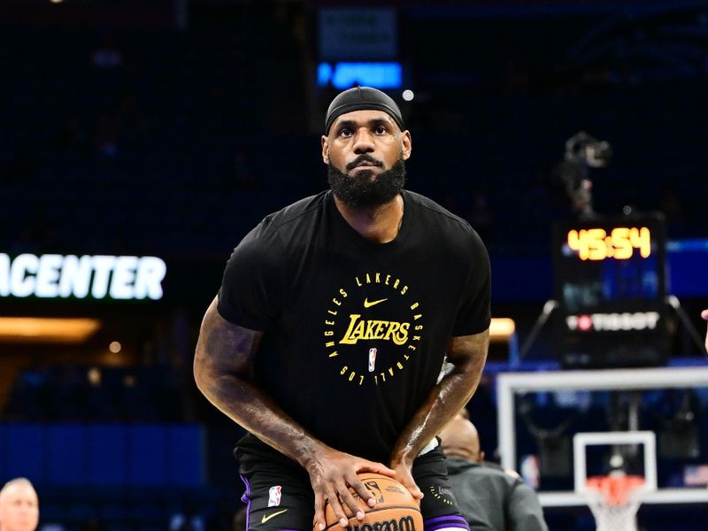 ORLANDO, FLORIDA - MARCH 24: LeBron James #23 of the Los Angeles Lakers warms up prior to a game against the Orlando Magic at Kia Center on March 24, 2025 in Orlando, Florida. NOTE TO USER: User expressly acknowledges and agrees that, by downloading and or using this photograph, User is consenting to the terms and conditions of the Getty Images License Agreement. (Photo by Julio Aguilar/Getty Images)