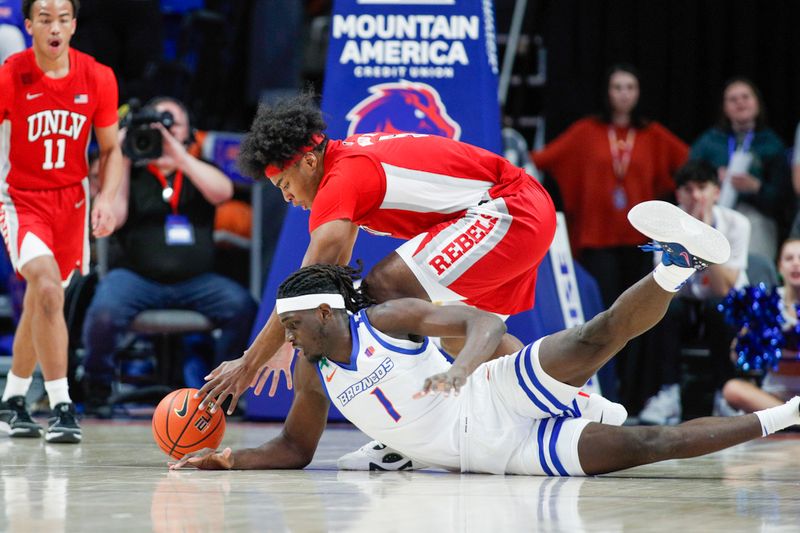 Jan 16, 2024; Boise, Idaho, USA; Boise State Broncos forward O'Mar Stanley (1) fights for the ball with UNLV Rebels forward Rob Whaley Jr. (5) during the first half  at ExtraMile Arena. Mandatory Credit: Brian Losness-USA TODAY Sports

