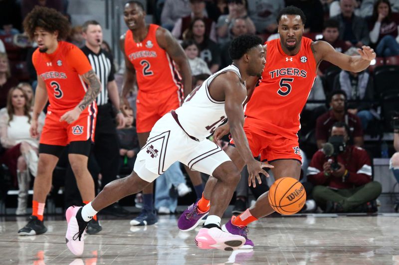 Jan 27, 2024; Starkville, Mississippi, USA; Mississippi State Bulldogs guard Josh Hubbard (13) dribbles as Auburn Tigers forward Chris Moore (5) defends during the first half at Humphrey Coliseum. Mandatory Credit: Petre Thomas-USA TODAY Sports