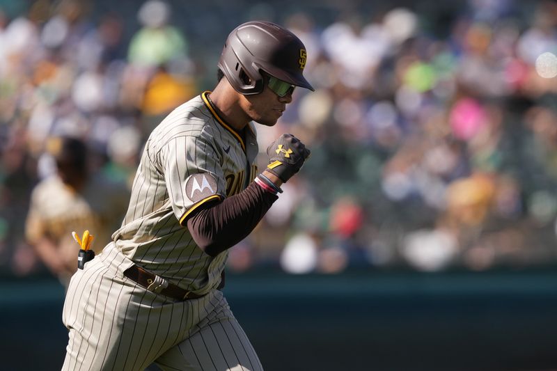 Sep 17, 2023; Oakland, California, USA; San Diego Padres left fielder Juan Soto (22) gestures after hitting a grand slam home run against the Oakland Athletics during the eighth inning at Oakland-Alameda County Coliseum. Mandatory Credit: Darren Yamashita-USA TODAY Sports