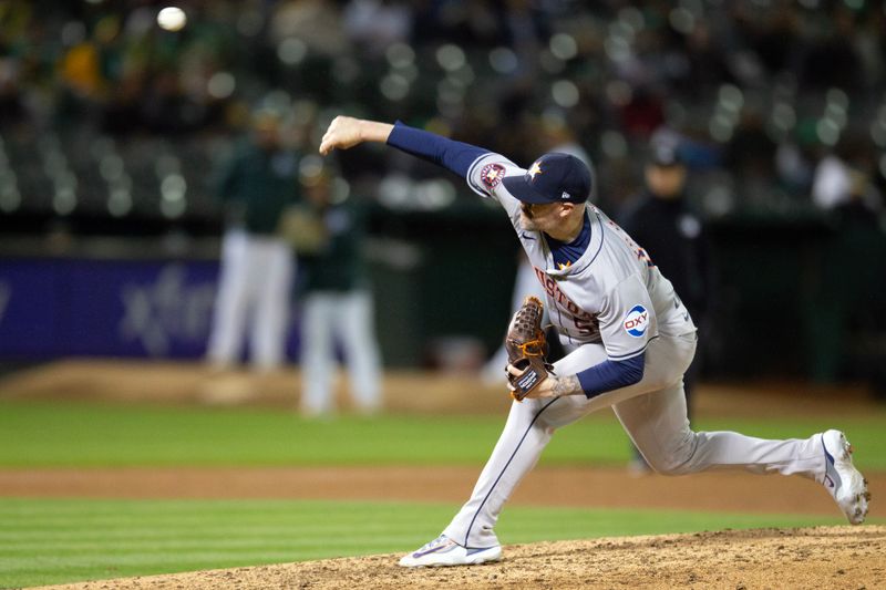 May 24, 2024; Oakland, California, USA; Houston Astros pitcher Ryan Pressly (55) delivers a pitch against the Oakland Athletics during the eighth inning at Oakland-Alameda County Coliseum. Mandatory Credit: D. Ross Cameron-USA TODAY Sports