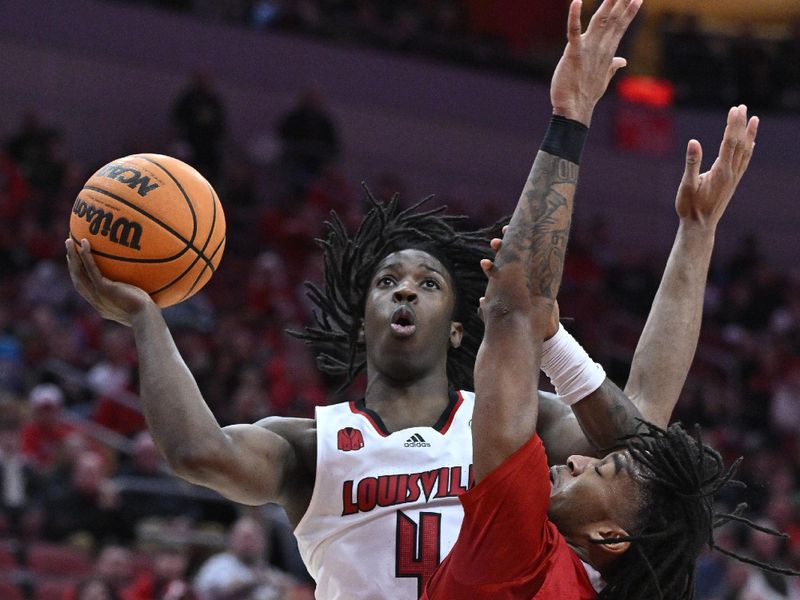 Jan 13, 2024; Louisville, Kentucky, USA;  Louisville Cardinals guard Ty-Laur Johnson (4) shoots against North Carolina State Wolfpack guard Jayden Taylor (1) during the second half at KFC Yum! Center. Mandatory Credit: Jamie Rhodes-USA TODAY Sports