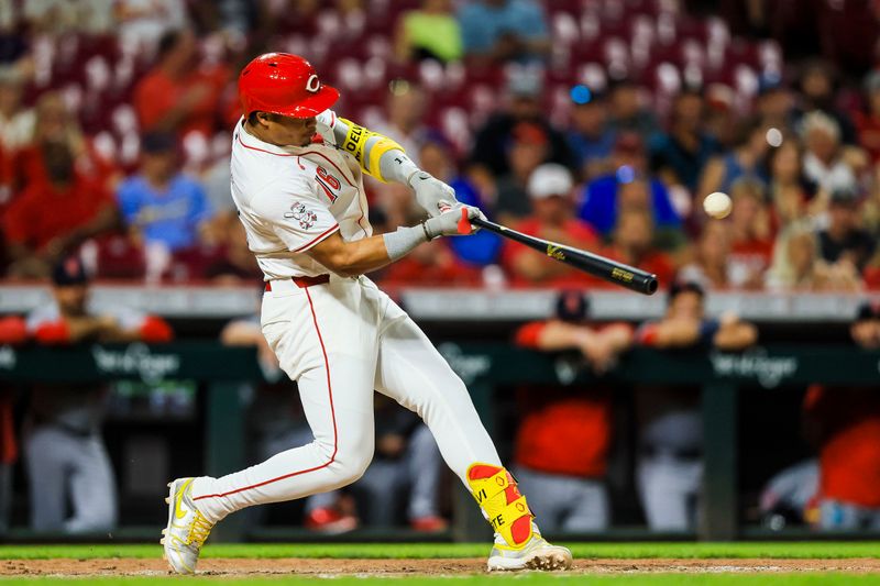 Aug 14, 2024; Cincinnati, Ohio, USA; Cincinnati Reds third baseman Noelvi Marte (16) hits a single in the eighth inning against the St. Louis Cardinals at Great American Ball Park. Mandatory Credit: Katie Stratman-USA TODAY Sports