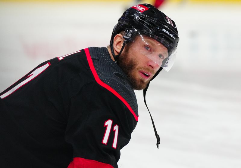 Jan 19, 2024; Raleigh, North Carolina, USA; Carolina Hurricanes center Jordan Staal (11) looks on during the warmups before the game against the Detroit Red Wings at PNC Arena. Mandatory Credit: James Guillory-USA TODAY Sports