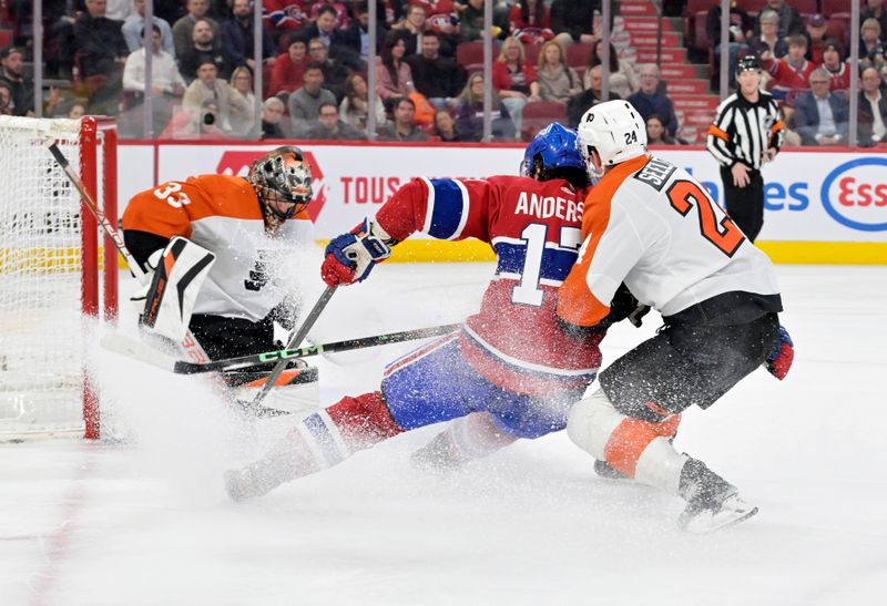 Apr 9, 2024; Montreal, Quebec, CAN; Montreal Canadiens forward Josh Anderson (17) scores a goal against Philadelphia Flyers goalie Samuel Ersson (33) during the first period at the Bell Centre. Mandatory Credit: Eric Bolte-USA TODAY Sports