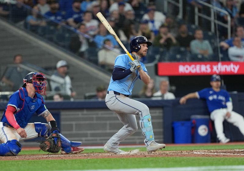 May 13, 2025; Toronto, Ontario, CAN; Tampa Bay Rays designated hitter Brandon Lowe (8) reacts after hitting a single against the Toronto Blue Jays during the ninth inning at Rogers Centre. Mandatory Credit: Nick Turchiaro-Imagn Images