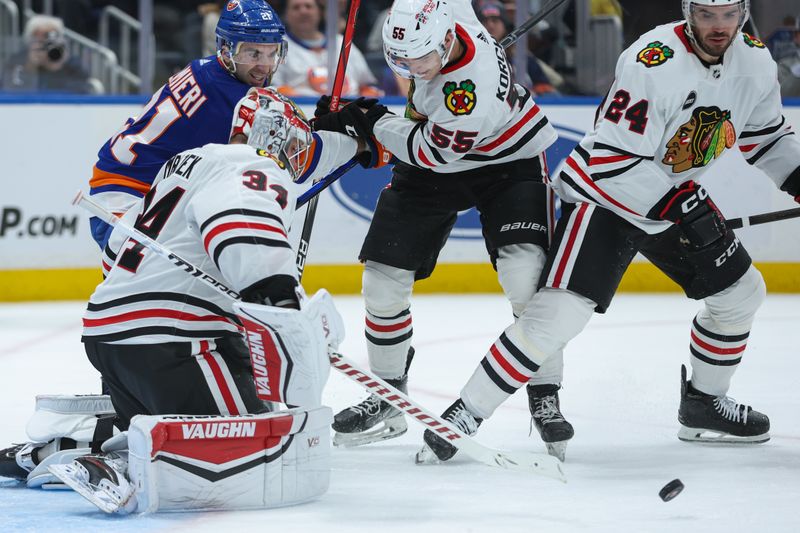 Apr 2, 2024; Elmont, New York, USA; Chicago Blackhawks goaltender Petr Mrazek (34) tracks the puck against the New York Islanders during the second period at UBS Arena. Mandatory Credit: Thomas Salus-USA TODAY Sports