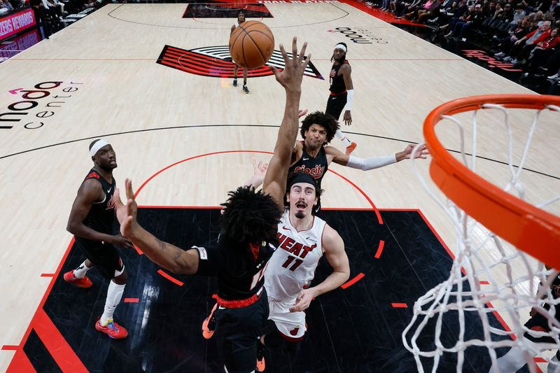 PORTLAND, OREGON - FEBRUARY 27: Jaime Jaquez Jr. #11 of the Miami Heat shoots the ball against Ashton Hagans #19 of the Portland Trail Blazers during the second half at Moda Center on February 27, 2024 in Portland, Oregon. NOTE TO USER: User expressly acknowledges and agrees that, by downloading and or using this photograph, User is consenting to the terms and conditions of the Getty Images License Agreement. (Photo by Soobum Im/Getty Images)