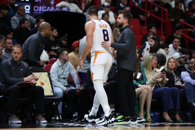 MIAMI, FLORIDA - JANUARY 29: Grayson Allen #8 of the Phoenix Suns leaves the game with an apparent injury during the second quarter of the game against the Miami Heat at Kaseya Center on January 29, 2024 in Miami, Florida. NOTE TO USER: User expressly acknowledges and agrees that, by downloading and or using this photograph, User is consenting to the terms and conditions of the Getty Images License Agreement. (Photo by Megan Briggs/Getty Images)