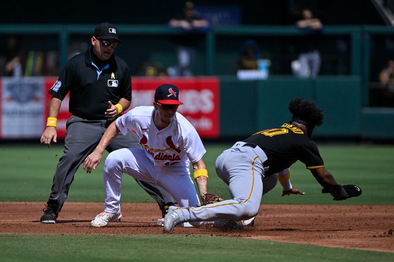 Sep 3, 2023; St. Louis, Missouri, USA;  St. Louis Cardinals shortstop Tommy Edman (19) tags out Pittsburgh Pirates shortstop Liover Peguero (60) during the second inning at Busch Stadium. Mandatory Credit: Jeff Curry-USA TODAY Sports