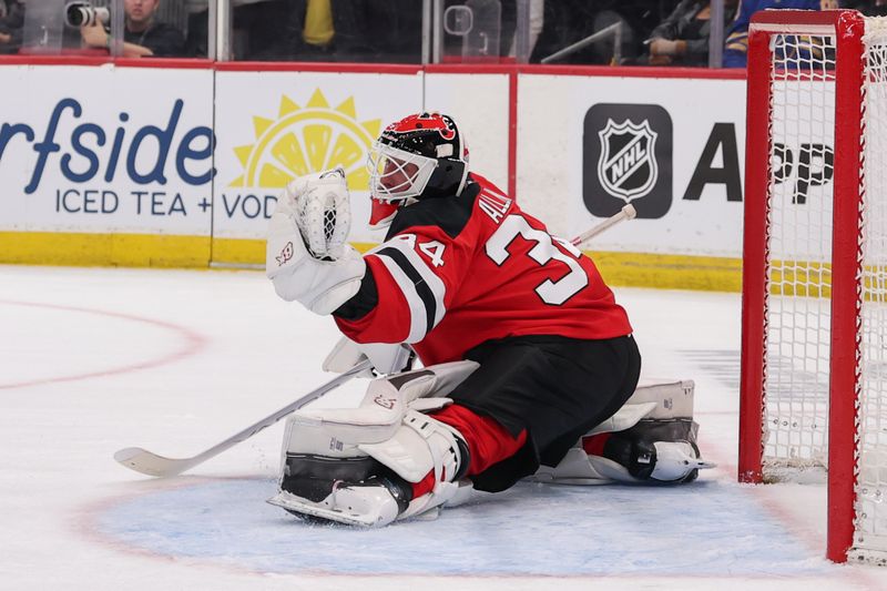 Feb 25, 2026; Newark, New Jersey, USA; New Jersey Devils goaltender Jake Allen (34) makes a save against the Buffalo Sabres during the first period at Prudential Center. Mandatory Credit: Ed Mulholland-Imagn Images
