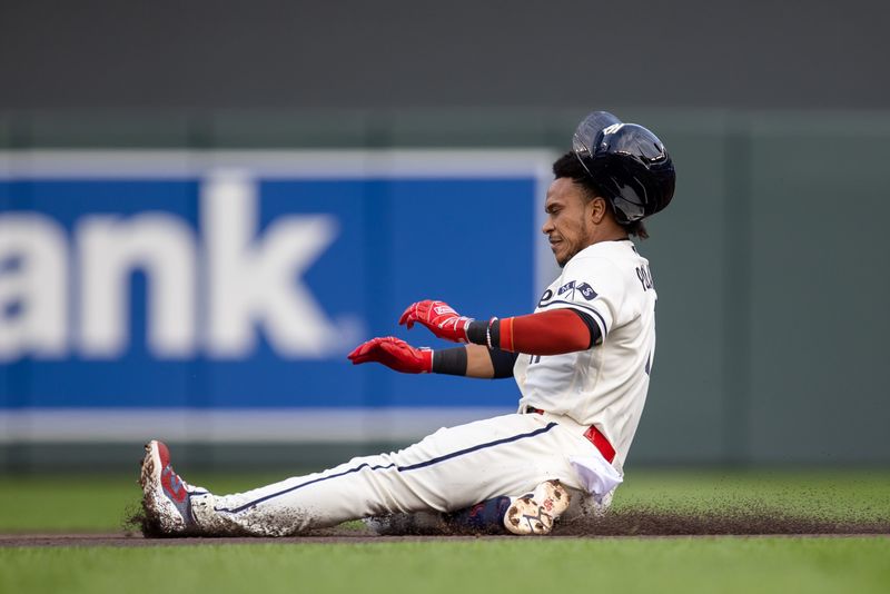 May 10, 2023; Minneapolis, Minnesota, USA; Minnesota Twins second baseman Jorge Polanco (11) slides safely into second base after hitting a double in the second inning against the San Diego Padres at Target Field. Mandatory Credit: Jesse Johnson-USA TODAY Sports