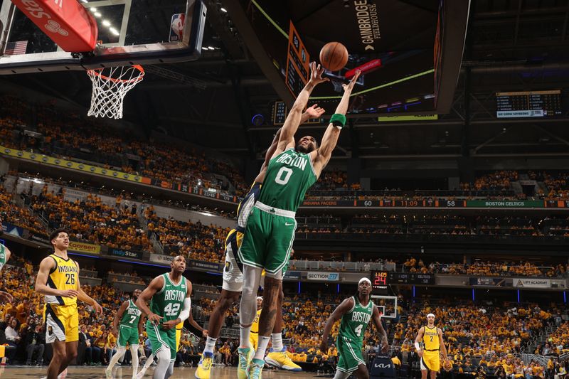 INDIANAPOLIS, IN - MAY 27: Jayson Tatum #0 of the Boston Celtics rebounds the ball during the game against the Indiana Pacers during Game 4 of the Eastern Conference Finals of the 2024 NBA Playoffs on May 27, 2024 at Gainbridge Fieldhouse in Indianapolis, Indiana. NOTE TO USER: User expressly acknowledges and agrees that, by downloading and or using this Photograph, user is consenting to the terms and conditions of the Getty Images License Agreement. Mandatory Copyright Notice: Copyright 2024 NBAE (Photo by Nathaniel S. Butler/NBAE via Getty Images)