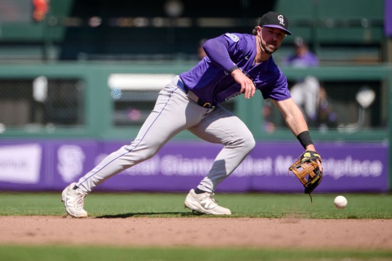 May 4, 2025; San Francisco, California, USA; Colorado Rockies second baseman Kyle Farmer (6) fields a ground ball against the San Francisco Giants during the eighth inning at Oracle Park. Mandatory Credit: Robert Edwards-Imagn Images