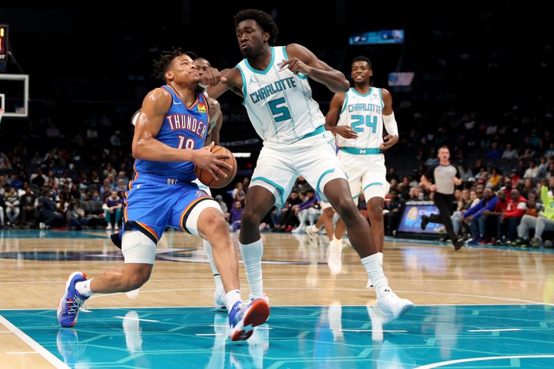 CHARLOTTE, NC - OCTOBER 15: Keyontae Johnson #18 of the Oklahoma City Thunder drives to the basket during the game against the Charlotte Hornets on October 15, 2023 at Spectrum Center in Charlotte, North Carolina. NOTE TO USER: User expressly acknowledges and agrees that, by downloading and or using this photograph, User is consenting to the terms and conditions of the Getty Images License Agreement.  Mandatory Copyright Notice:  Copyright 2023 NBAE (Photo by Brock Williams-Smith/NBAE via Getty Images)