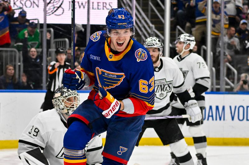 Mar 13, 2024; St. Louis, Missouri, USA;  St. Louis Blues left wing Jake Neighbours (63) reacts after scoring against Los Angeles Kings goaltender Cam Talbot (39) during the second period at Enterprise Center. Mandatory Credit: Jeff Curry-USA TODAY Sports