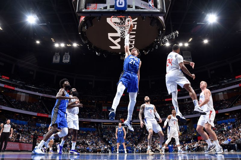 ORLANDO, FL - MARCH 29: Moritz Wagner #21 of the Orlando Magic drives to the basket during the game against the LA Clippers on March 29, 2024 at the Kia Center in Orlando, Florida. NOTE TO USER: User expressly acknowledges and agrees that, by downloading and or using this photograph, User is consenting to the terms and conditions of the Getty Images License Agreement. Mandatory Copyright Notice: Copyright 2024 NBAE (Photo by Fernando Medina/NBAE via Getty Images)