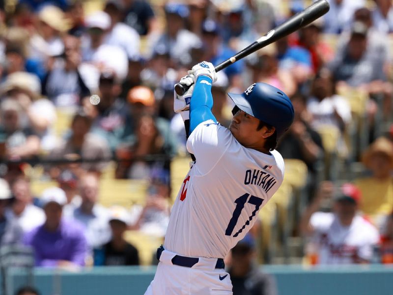 May 5, 2024; Los Angeles, California, USA;  Los Angeles Dodgers designated hitter Shohei Ohtani (17) hits a home run during the first inning against the Atlanta Braves at Dodger Stadium. Mandatory Credit: Kiyoshi Mio-USA TODAY Sports