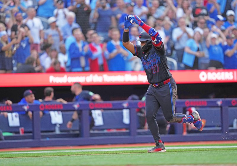 Jul 24, 2024; Toronto, Ontario, CAN; Toronto Blue Jays first baseman Vladimir Guerrero Jr. (27) runs the bases and celebrates hitting a home run against the Tampa Bay Rays during the third inning at Rogers Centre. Mandatory Credit: Nick Turchiaro-USA TODAY Sports