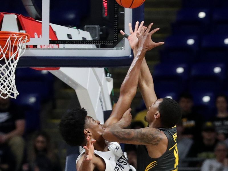 Jan 1, 2023; University Park, Pennsylvania, USA; Penn State Nittany Lions forward Kebba Njie (3) defends as Iowa Hawkeyes guard Tony Perkins (11) shoots the ball during the first half at Bryce Jordan Center. Mandatory Credit: Matthew OHaren-USA TODAY Sports