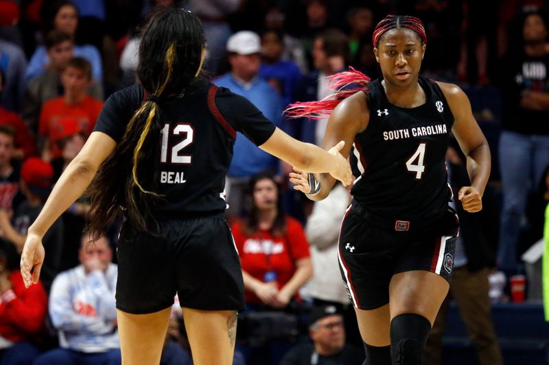 Feb 19, 2023; Oxford, Mississippi, USA; South Carolina Gamecocks forward Aliyah Boston (4) celebrates with South Carolina Gamecocks guard Brea Beal (12) after scoring a basket during the second half at The Sandy and John Black Pavilion at Ole Miss. Mandatory Credit: Petre Thomas-USA TODAY Sports