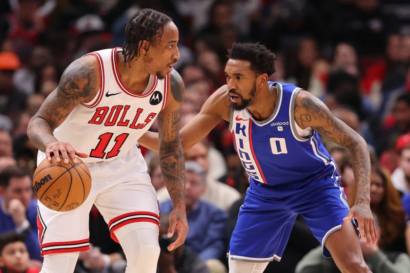 CHICAGO, ILLINOIS - FEBRUARY 03: DeMar DeRozan #11 of the Chicago Bulls is defended by Malik Monk #0 of the Sacramento Kings during the first half at the United Center on February 03, 2024 in Chicago, Illinois. NOTE TO USER: User expressly acknowledges and agrees that, by downloading and or using this photograph, User is consenting to the terms and conditions of the Getty Images License Agreement.  (Photo by Michael Reaves/Getty Images)