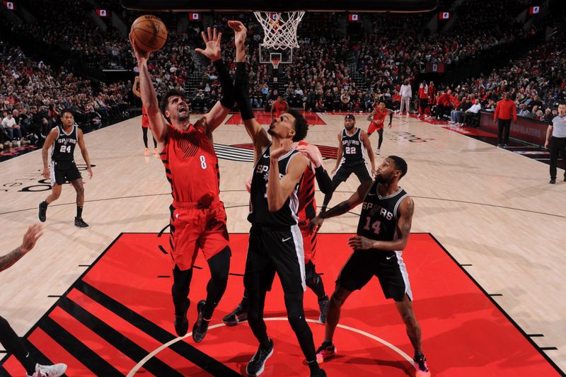 PORTLAND, OR - DECEMBER 13: Deni Avdija #8 of the Portland Trail Blazers drives to the basket during the game against the San Antonio Spurs on December 13, 2024 at the Moda Center Arena in Portland, Oregon. NOTE TO USER: User expressly acknowledges and agrees that, by downloading and or using this photograph, user is consenting to the terms and conditions of the Getty Images License Agreement. Mandatory Copyright Notice: Copyright 2024 NBAE (Photo by Cameron Browne/NBAE via Getty Images)