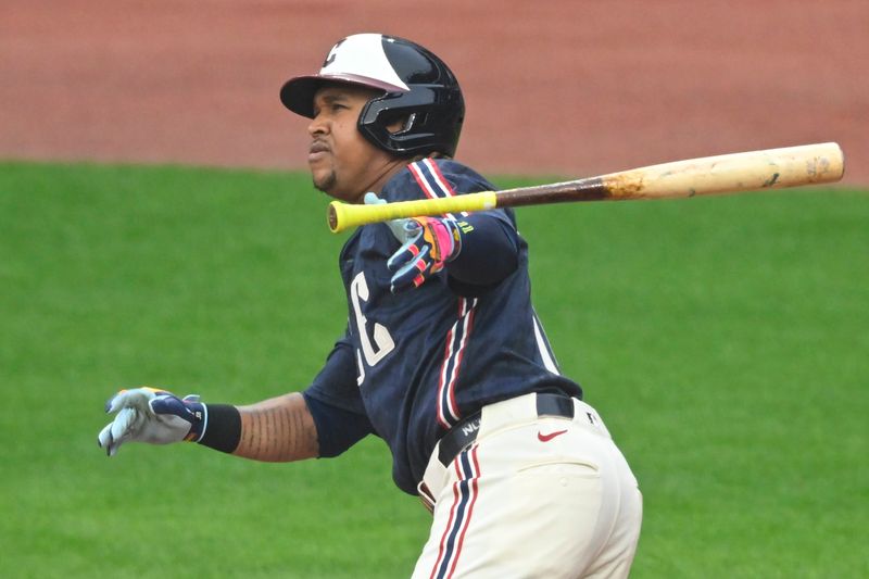 Jun 6, 2025; Cleveland, Ohio, USA; Cleveland Guardians third baseman Jose Ramirez (11) singles in the first inning against the Houston Astros at Progressive Field. Mandatory Credit: David Richard-Imagn Images