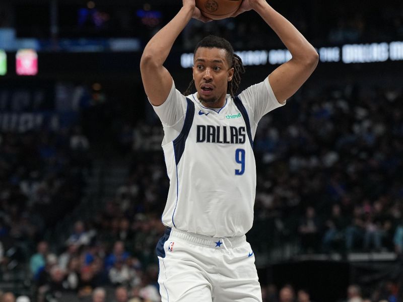 DALLAS, TX - FEBRUARY 27: Moses Brown #9 of the Dallas Mavericks looks to pass the ball during the game against the Charlotte Hornets on February 27, 2025 at American Airlines Center in Dallas, Texas. NOTE TO USER: User expressly acknowledges and agrees that, by downloading and or using this photograph, User is consenting to the terms and conditions of the Getty Images License Agreement. Mandatory Copyright Notice: Copyright 2025 NBAE(Photo by Glenn James/NBAE via Getty Images)