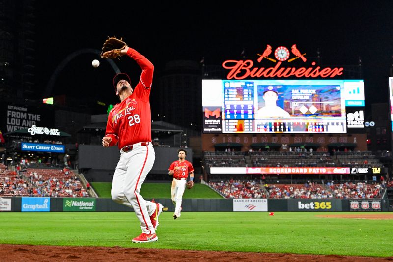 Apr 25, 2025; St. Louis, Missouri, USA;  St. Louis Cardinals third baseman Nolan Arenado (28) drops a foul ball hit by Milwaukee Brewers right fielder Sal Frelick (not pictured) during the seventh inning at Busch Stadium. Mandatory Credit: Jeff Curry-Imagn Images
