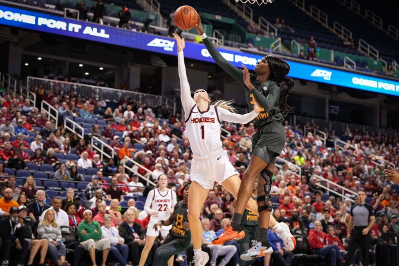 Mar 8, 2024; Greensboro, NC, USA; Miami Hurricanes forward Latasha Lattimore (35) blocks the attempted shot of Virginia Tech Hokies guard Carleigh Wenzel (1) in the first half at Greensboro Coliseum. Mandatory Credit: David Yeazell-USA TODAY Sports