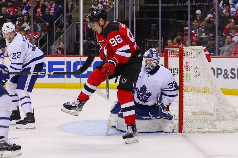 Mar 7, 2023; Newark, New Jersey, USA; Toronto Maple Leafs goaltender Ilya Samsonov (35) makes a save through a screen by New Jersey Devils right wing Timo Meier (96) during the second period at Prudential Center. Mandatory Credit: Ed Mulholland-USA TODAY Sports