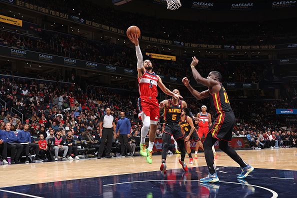 WASHINGTON, DC -? DECEMBER 31: Tyus Jones #5 of the Washington Wizards shoots the ball during the game against the Atlanta Hawks on December 31, 2023 at Capital One Arena in Washington, DC. NOTE TO USER: User expressly acknowledges and agrees that, by downloading and or using this Photograph, user is consenting to the terms and conditions of the Getty Images License Agreement. Mandatory Copyright Notice: Copyright 2023 NBAE (Photo by Stephen Gosling/NBAE via Getty Images)