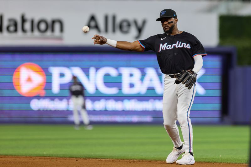 Jul 5, 2024; Miami, Florida, USA; Miami Marlins second baseman Vidal Brujan (17) throws to first base to retire Chicago White Sox left fielder Andrew Benintendi (not pictured) during the third inning at loanDepot Park. Mandatory Credit: Sam Navarro-USA TODAY Sports