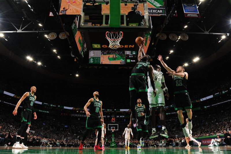 BOSTON, MA - MARCH 20: Jaylen Brown #7 of the Boston Celtics rebounds the ball during the game against the Milwaukee Bucks on March 20, 2024 at the TD Garden in Boston, Massachusetts. NOTE TO USER: User expressly acknowledges and agrees that, by downloading and or using this photograph, User is consenting to the terms and conditions of the Getty Images License Agreement. Mandatory Copyright Notice: Copyright 2024 NBAE  (Photo by Brian Babineau/NBAE via Getty Images)