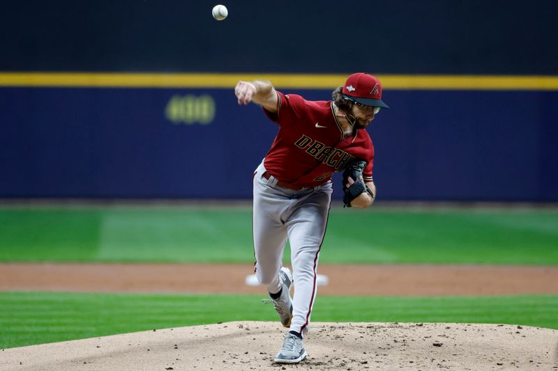 Oct 4, 2023; Milwaukee, Wisconsin, USA; Arizona Diamondbacks starting pitcher Zac Gallen (23) pitches against the Milwaukee Brewers in the first inning during game two of the Wildcard series for the 2023 MLB playoffs at American Family Field. Mandatory Credit: Kamil Krzaczynski-USA TODAY Sports