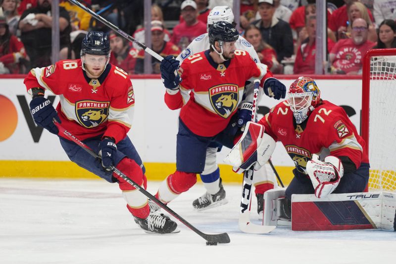 Apr 29, 2024; Sunrise, Florida, USA; Florida Panthers center Steven Lorentz (18) clears the defensive zone as goaltender Sergei Bobrovsky (72) looks on against the Tampa Bay Lightning during the first period in game five of the first round of the 2024 Stanley Cup Playoffs at Amerant Bank Arena. Mandatory Credit: Jim Rassol-USA TODAY Sports