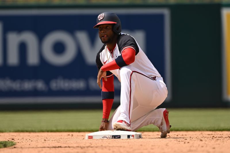 May 26, 2024; Washington, District of Columbia, USA; Washington Nationals center fielder Victor Robles rets on the bag after stealing second base against the Seattle Mariners during the sixth inning at Nationals Park. Mandatory Credit: Rafael Suanes-USA TODAY Sports