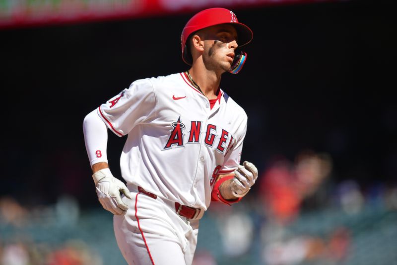 Jun 27, 2024; Anaheim, California, USA; Los Angeles Angels shortstop Zach Neto (9) runs the bases after hitting a three run home run against the Detroit Tigers during the ninth inning at Angel Stadium. Mandatory Credit: Gary A. Vasquez-USA TODAY Sports