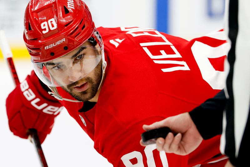 Jan 14, 2025; Detroit, Michigan, USA;  Detroit Red Wings center Joe Veleno (90) gets set to face off in the second period against the San Jose Sharks at Little Caesars Arena. Mandatory Credit: Rick Osentoski-Imagn Images