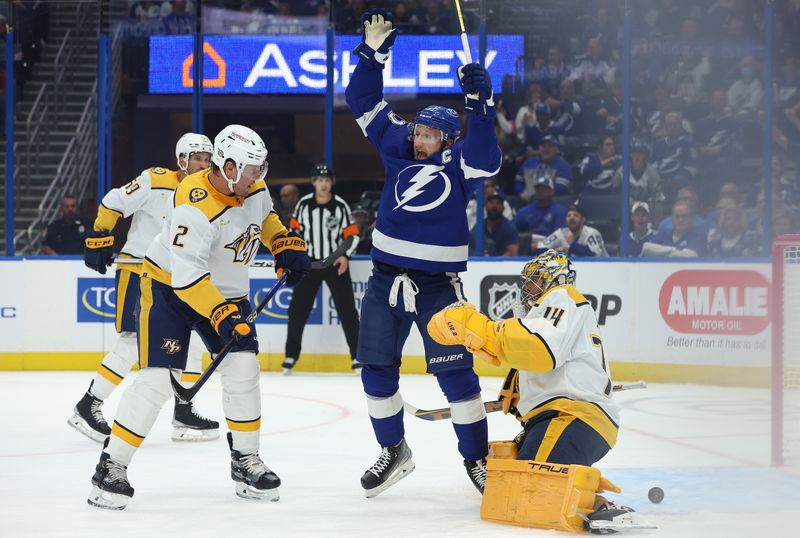 Oct 10, 2023; Tampa, Florida, USA; Tampa Bay Lightning center Steven Stamkos (91) celebrates after  right wing Nikita Kucherov (86) (not pictured) scored a goal on Nashville Predators goaltender Juuse Saros (74)  during the first period at Amalie Arena. Mandatory Credit: Kim Klement Neitzel-USA TODAY Sports