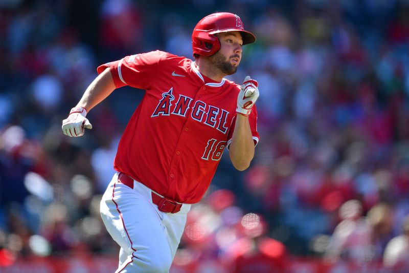 May 26, 2024; Anaheim, California, USA; Los Angeles Angels first base Nolan Schanuel (18) hits a double against the Cleveland Guardians during the eighth inning at Angel Stadium. Mandatory Credit: Gary A. Vasquez-USA TODAY Sports
