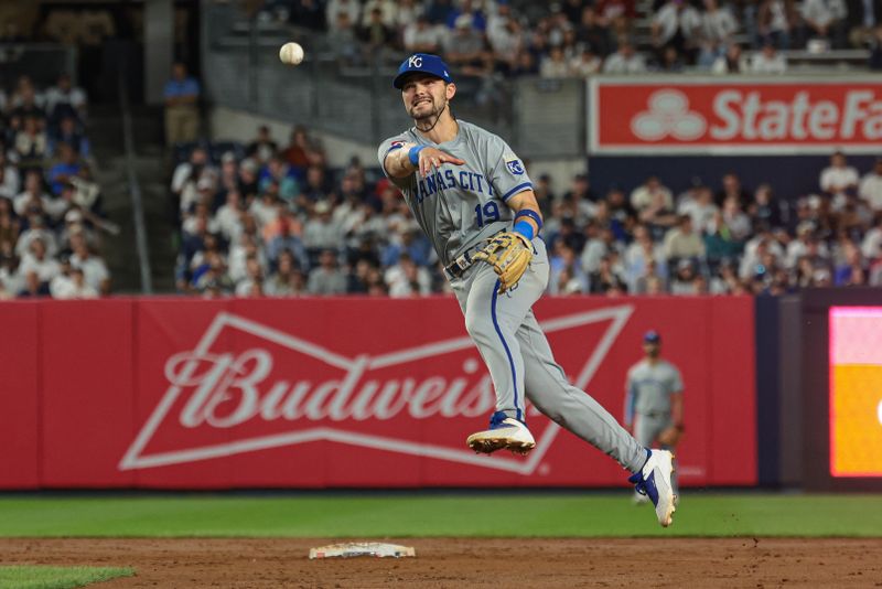 Sep 11, 2024; Bronx, New York, USA; Kansas City Royals second baseman Michael Massey (19) throws the ball to first base for an out during the ninth inning against the New York Yankees at Yankee Stadium. Mandatory Credit: Vincent Carchietta-Imagn Images