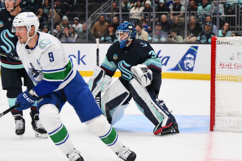 Nov 24, 2023; Seattle, Washington, USA; Seattle Kraken goaltender Joey Daccord (35) defends the goal against the Vancouver Canucks during the first period at Climate Pledge Arena. Mandatory Credit: Steven Bisig-USA TODAY Sports